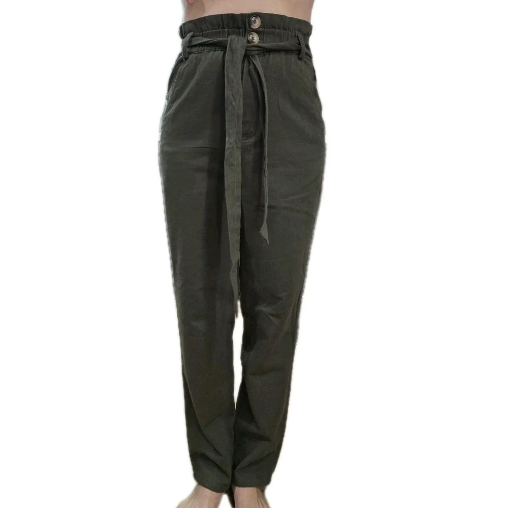 Rebels & Lovers casual pants featuring a flattering paperbag high-rise waist....
